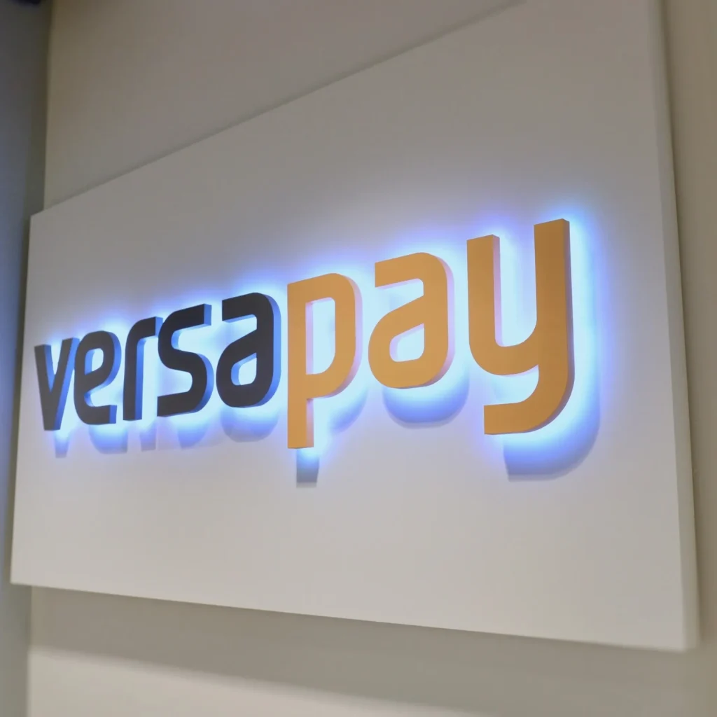 halo lit 3D letters on a white sign panel