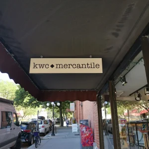 an under awning wood blade sign