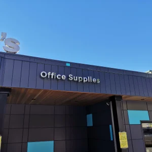 metal channel letter signage that says office supplies above entrance to store
