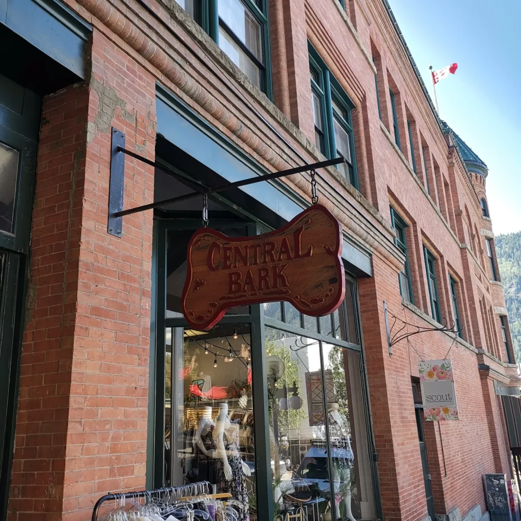wooden blade sign on hanging off a metal structure