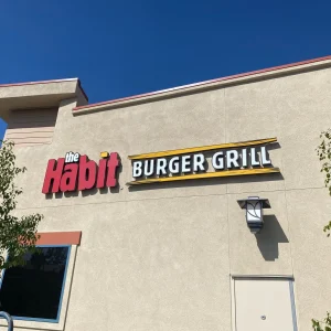 Custom channel letter sign for a burger restaurant installed on exterior wall.