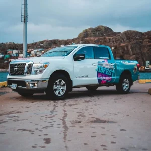 A truck with a partial wrap.